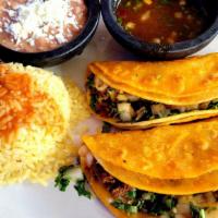 Beef Birria Quesadilla Dinner · Two delicious cheese quesadillas stuffed with our delicious beef birria. Served with rice an...