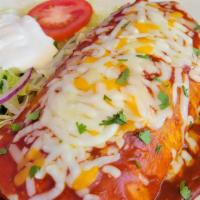 Enchilada Burrito · Delicious burrito topped with homemade enchilada sauce, melted cheese and sour cream and you...