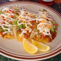 Fish Taco Dinner · Fresh fried fish, served on a corn tortilla with rice, pico de gallo, house dressing and che...