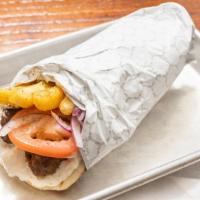 Skewer Kabob - Gr Beef @ Gr Lamb · Pita bread, tomatoes, onions, french fries (in sandwich), and tzatziki.