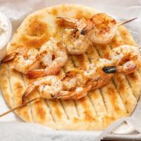 Charcoal Grilled Shrimp Skewers · No Substitutions. Pita bread, tzatziki & lemon slices.