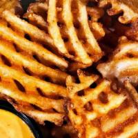 Spicy Waffle Fries · These fries are packed with flavor. Served with our Boom Boom dipping sauce.