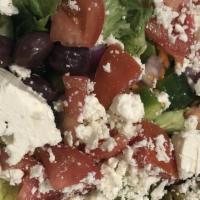 Greek Salad · Lettuce, Tomato, Cucumber, Feta Cheese, Black Olives w/flour Tortilla & Greek Dressing.