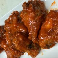 Sriracha Wings · Medium Spicy. Fried spicy saucy wings battered with flour coated with flavorful buttery hot ...