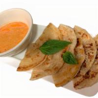 Roti & Curry Dip · Mild Spicy. Vegan. Pan-fried dough (crepe) served with dice sweet potato and peanut in Massa...