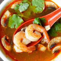 Tom Yum Koong (Hot And Sour Soup) · Thai spicy soup with shrimp, mushroom, tomato, cilantro, and scallion in lemongrass and gala...