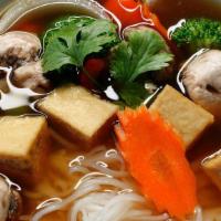 Veggie Noodle Soup · Vegan. Thin rice noodles with assorted vegetables and tofu in veggie broth topped with cilan...