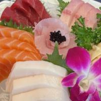 Sashimi Deluxe Entree · 15 pieces of assorted fillets of raw fish and rice. Served with miso soup and house salad.