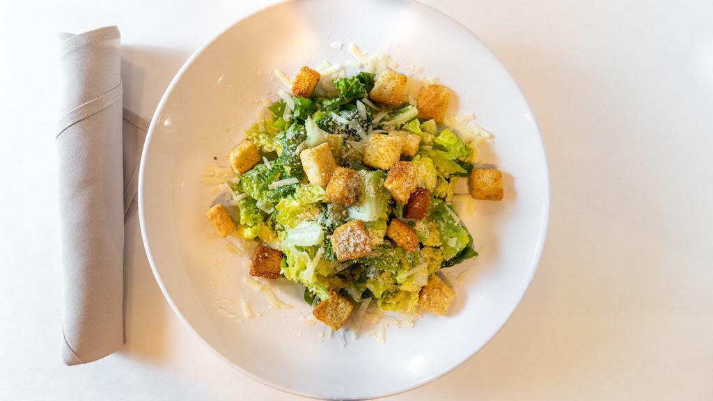 Caesar Salad · Crisp romaine tossed with Parmesan cheese and our homemade dressing.