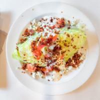 Iceberg Wedge Salad · Gluten Conscious. Crisp wedge of fresh Iceberg topped with crumbled blue cheese, bacon, dice...