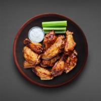 10 Pcs Classic Bone-In Wings · 10 classic bone-in traditional wings served in your choice of sauce.