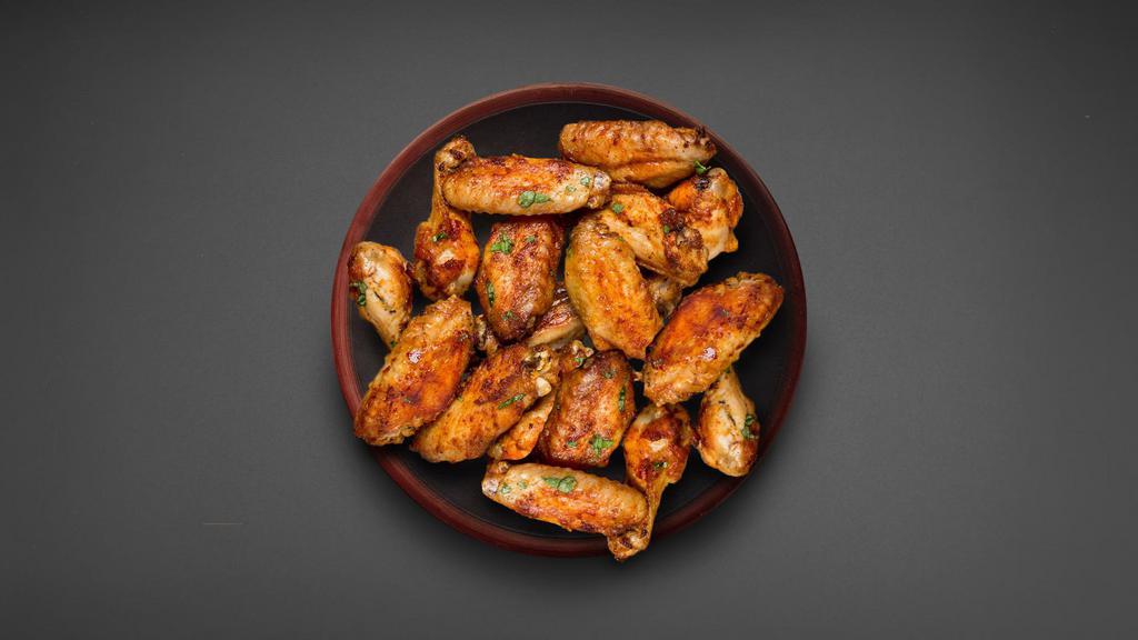 20 Pcs Classic Bone-In Wings · 20 classic bone-in traditional wings served in your choice of sauce.