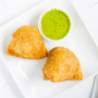 2 Vegetable Samosas · Spicy turnovers stuffed with potatoes and green peas.