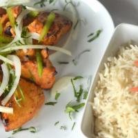 Chicken Tikka · Tender pieces of white meat chicken marinated in spicy yogurt and cooked on skewers in Tando...