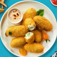Pop Goes The Jalapeno  · (Vegetarian) Fresh jalapenos coated in cream cheese and fried until golden brown.