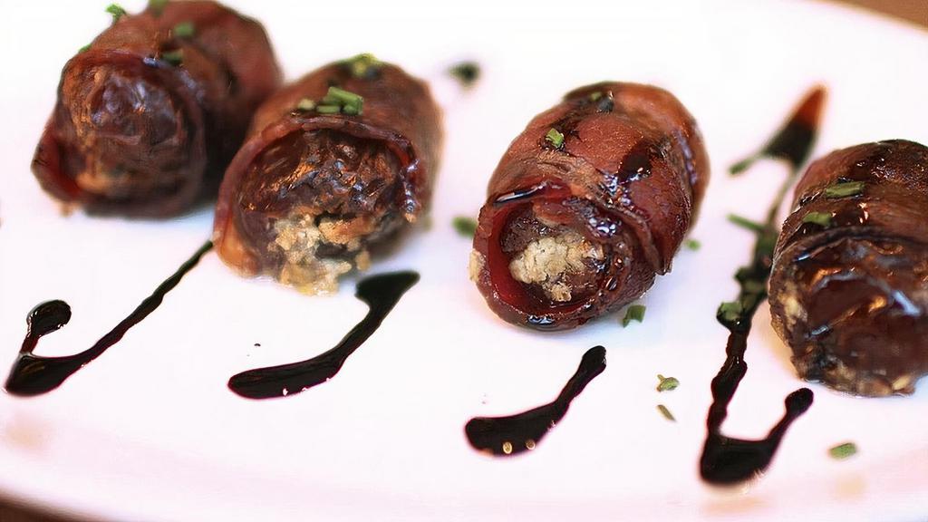 Blue Cheese Bacon Dates · Four bacon-wrapped dates stuffed with blue cheese. Roasted and finished with a sweet balsamic reduction.