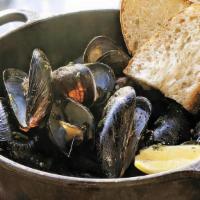 Spicy Sausage Pei Mussels · A generous portion of fresh mussels cooked in white wine, shallots & garlic, chicken broth, ...
