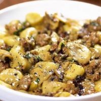 Sausage Mushroom Gnocchi · Fresh potato gnocchi tossed in a creamy, peppery amaretto sauce with spicy pork sausage and ...