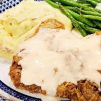 Chicken Fried Steak · Seasoned, breaded, and fried sirloin steak with a side of white gravy. Served with mashed po...