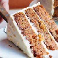 Carrot Cake Slice · Four layers, with golden raisins and our cream cheese icing. Served with our house-churned v...