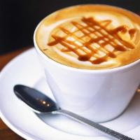 Caramel Latte · Made with our house-roasted XOXO Espresso. Full-bodied, with notes of dark cocoa, cranberry,...