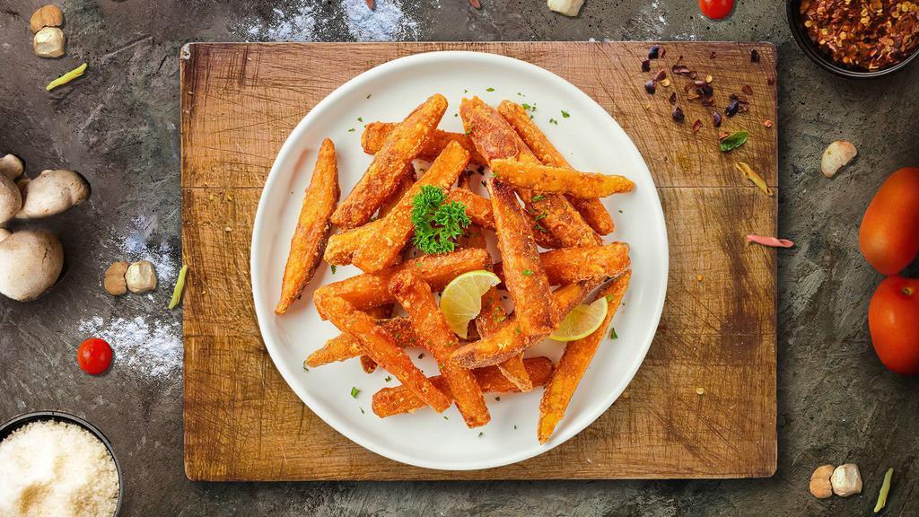 Sweet Delightful Potato Fries · Thick-cut sweet potato wedges fried until golden brown