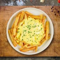 Cheesy Melt Fries · Idaho potato fries cooked until golden brown and garnished with salt and melted cheddar chee...