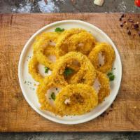 Crispy Rings · Sliced onions dipped in a light batter and fried until crispy and golden brown.