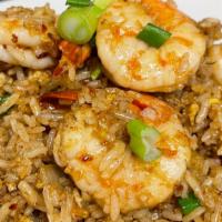 Spicy Fried Rice · Stir fried jasmine rice with egg, onion, bell peppers and scallions in house made roasted ch...