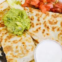 Quesadilla · cheese, side of lettuce, tomato & sour cream; includes choice of toppings