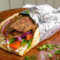 Gyros Meat Wrap · Lamb or chicken. Wrapped in pita with yogurt cucumber dip, cabbage, tomato cucumber salad, &...