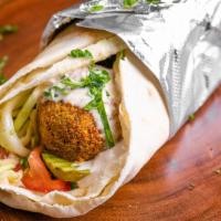 Deluxe Falafel Wrap (Vegan) · Moroccan eggplant, cauliflower stew , hummus, tomato cucumber salad, cabbage salad, pickles,...