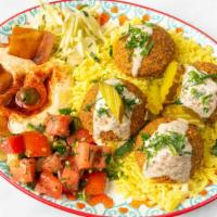 Vegetarian Falafel · Served with rice, hummus, salad, pickles, pita bread, & tahini sauce.