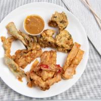 Vegetable Tempura · Batter-fried mixed vegetable in tempura style served with peanut sauce.
