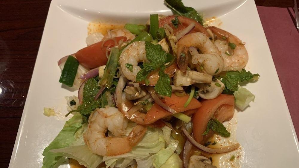 Lime Shrimp Salad · Hot. Steamed shrimp with red onion, lemongrass, tomato, mushroom, lettuce, scallion and cilantro mixed with spicy lime juice and pik-pow sauce.