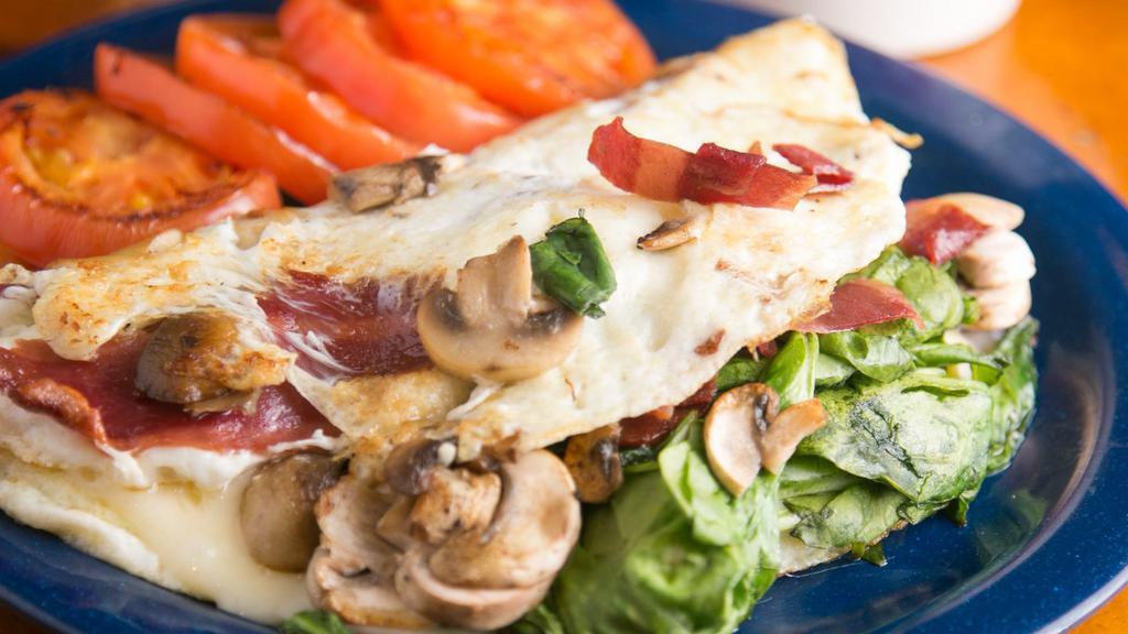 Egg White Omelet · Turkey bacon, spinach, mushrooms, and Swiss cheese.