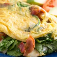 Florentine Omelet · Fresh baby spinach, onions, bacon, and Swiss cheese.