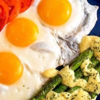 Asparagus And Eggs · Sauteed Asparagus topped with Hollandaise and three eggs.