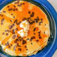 Chocolate Chip Pancakes · 3 Buttermilk pancakes filled with chocolate chips.