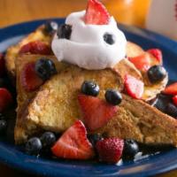 All American French Toast (3) · 3 French Toast topped with fresh strawberries, blueberries, and whipped cream.