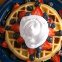 All American Waffle · Topped with whipped cream, strawberries and blueberries.