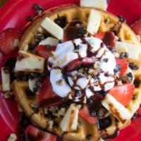 Banana Split Waffle · Sliced bananas, pineapple, strawberries, topped with walnuts, whipped cream and chocolate sy...