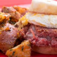 Hash On The Dash · Egg, melted cheese and our famous six hours corned beef hash. Shown with one side not includ...