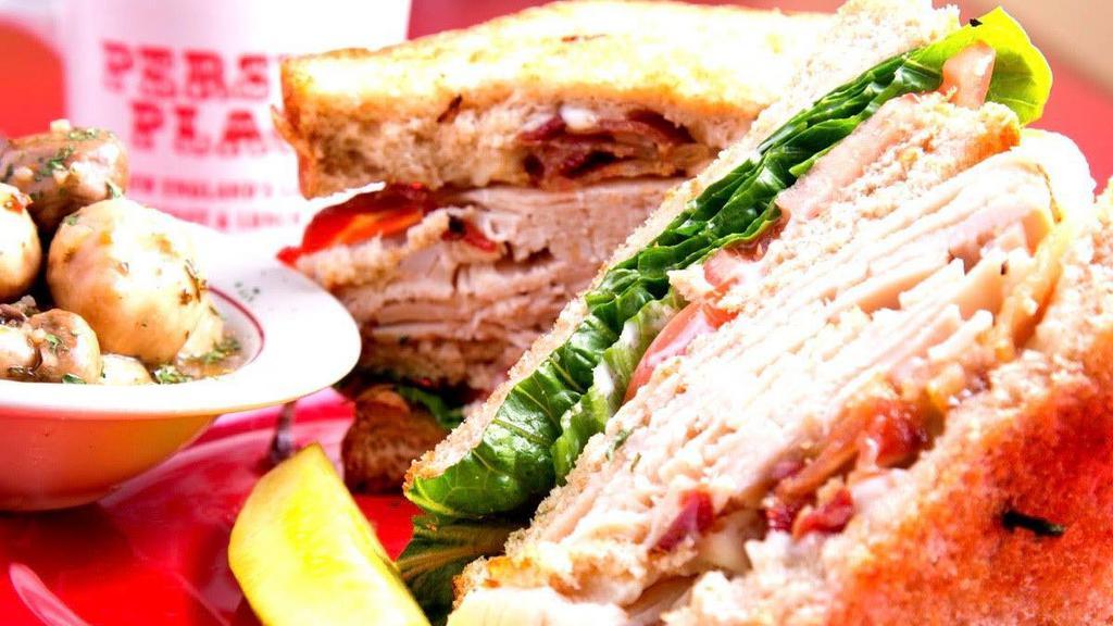 Turkey Club · Double-decker. Bacon, lettuce, tomato, mayo.