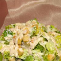 Caesar Salad / Салат Цезарь · Crispy romaine lettuce and croutons mixed in with homemade Caesar dressing.