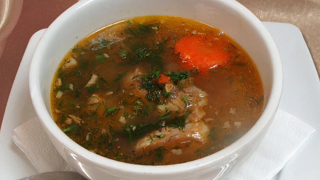 Shurpa / Шурпа · Light lamb broth with vegetables, cheek Pease and lamb meat.