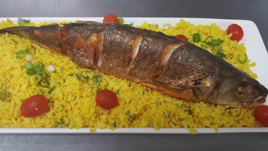 Baked Branzino / Запечоное Бранзини · (Also Known as Mediterranean Sea Bass) Baked -Served with stuffed mixed vegetables and with yellow rice.