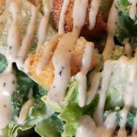 Caesar Salad · Crispy romaine lettuce and croutons mixed in with homemade Caesar dressing.