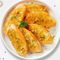 Baker'S Garlic Bread  · (Vegetarian) Housemade bread toasted and garnished with butter, garlic, and parsley.