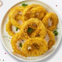 Ring On  · (Vegetarian) Sliced onions dipped in a light batter and fried until crispy and golden brown.